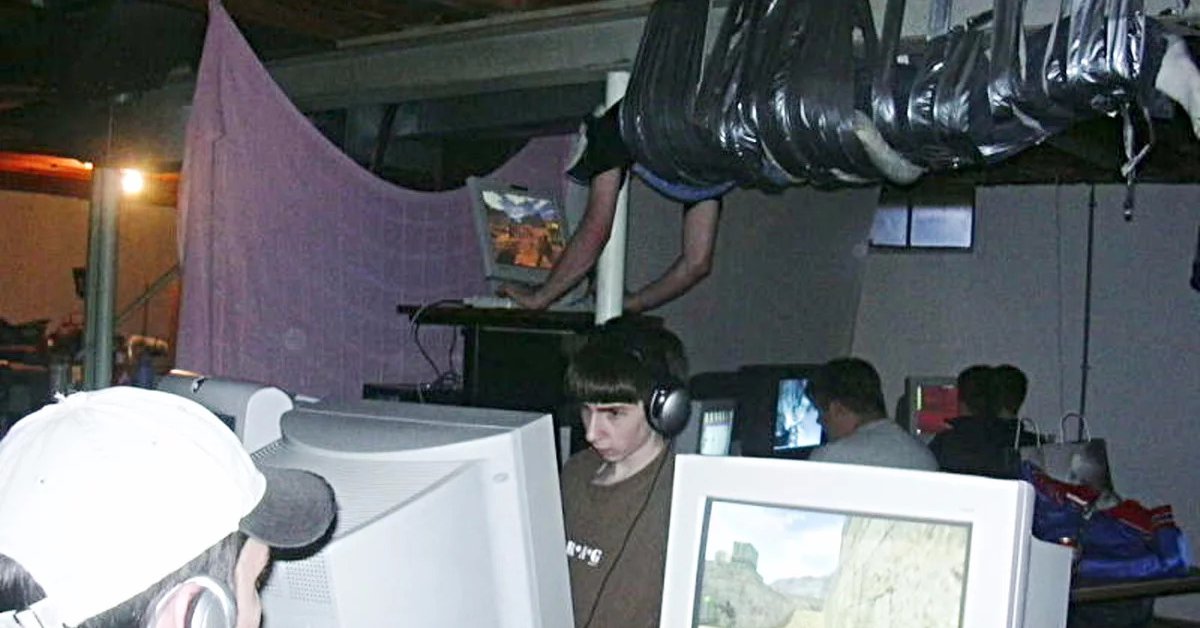 Guy Taped To Ceiling Lan Party The Truth Behind The Picture Of Gamer Played Counter-Strike While Being Duct-Taped To The
