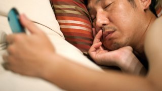 Falling Asleep, Man Continues Typing On Invisible Smartphone
