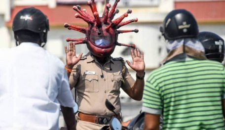 Indian Police Wearing A COVID-19 Helmet To Warn People To Stay Inside