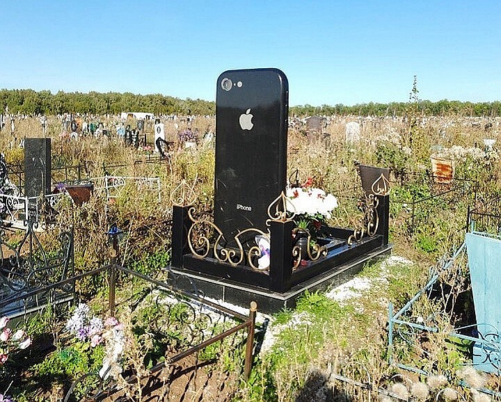 Image result for A giant iPhone stele in Russia's cemetery