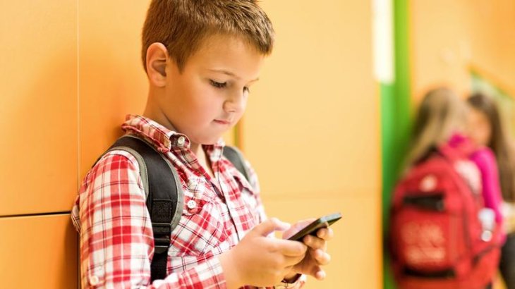 Image result for kid using smartphone
