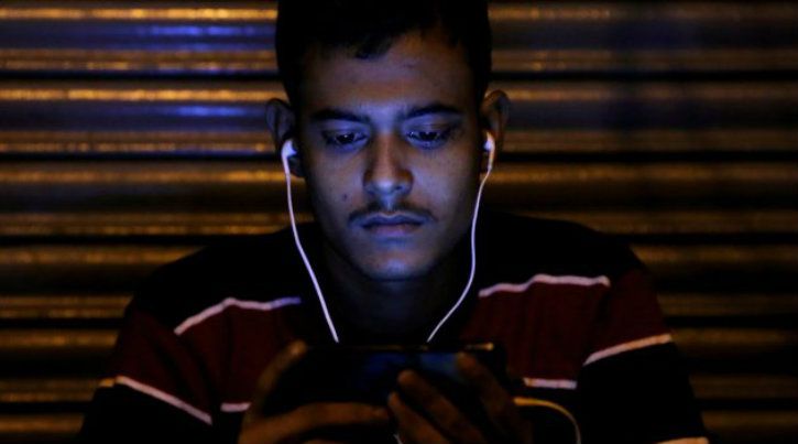 Man Using Phone Internet In India 1543209175